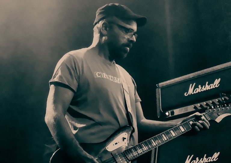Swervedriver's Adam Franklin playing guitar onstage next to a Marshall amplifier during a live concert at Lion Arts Factory in Adelaide.